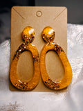 Boucle d'oreille ovale orange et or
